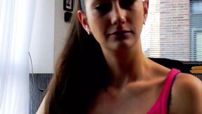 Dark haired German beauty with small tits stuffing a cucumber in her muff