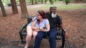 Nerdy Milf strokes and suck blk dick in the Park